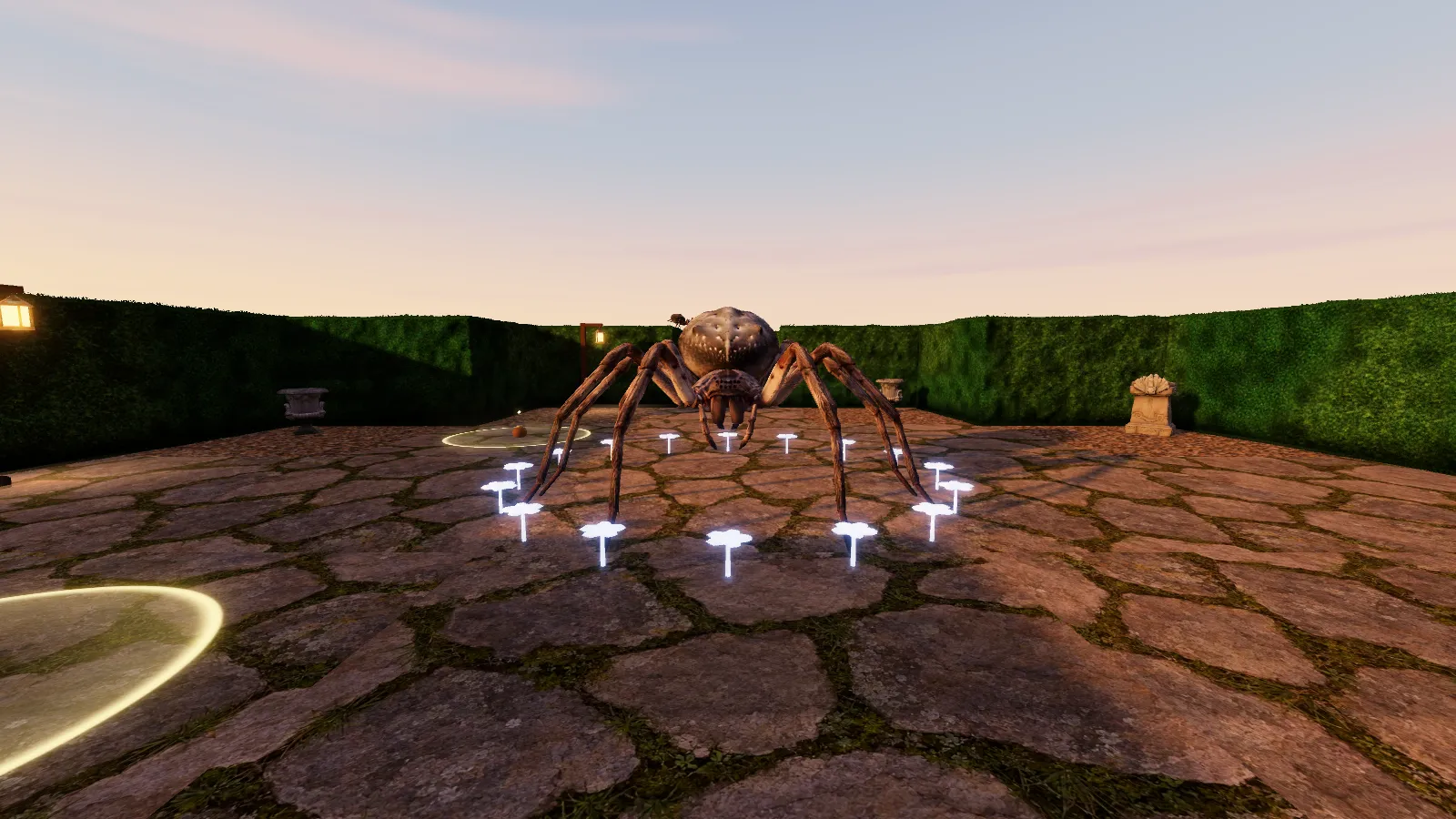 A giant pale spider stands inside a ring of glowing white flowers on a paved court among the hedges, seen at eye level at dusk